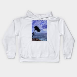 A palm tree on rock plateau with a rock island in the sea Kids Hoodie